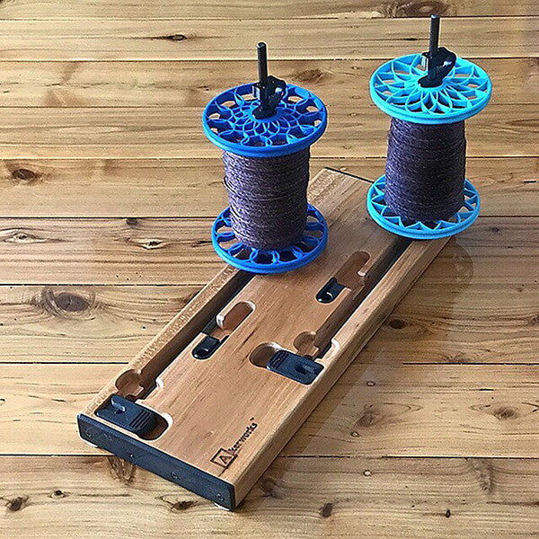 Flat-Pack Bobbins on Lazy Kate: Sunflower whorls in Royal Blue and Lotus whorls in Powder Blue