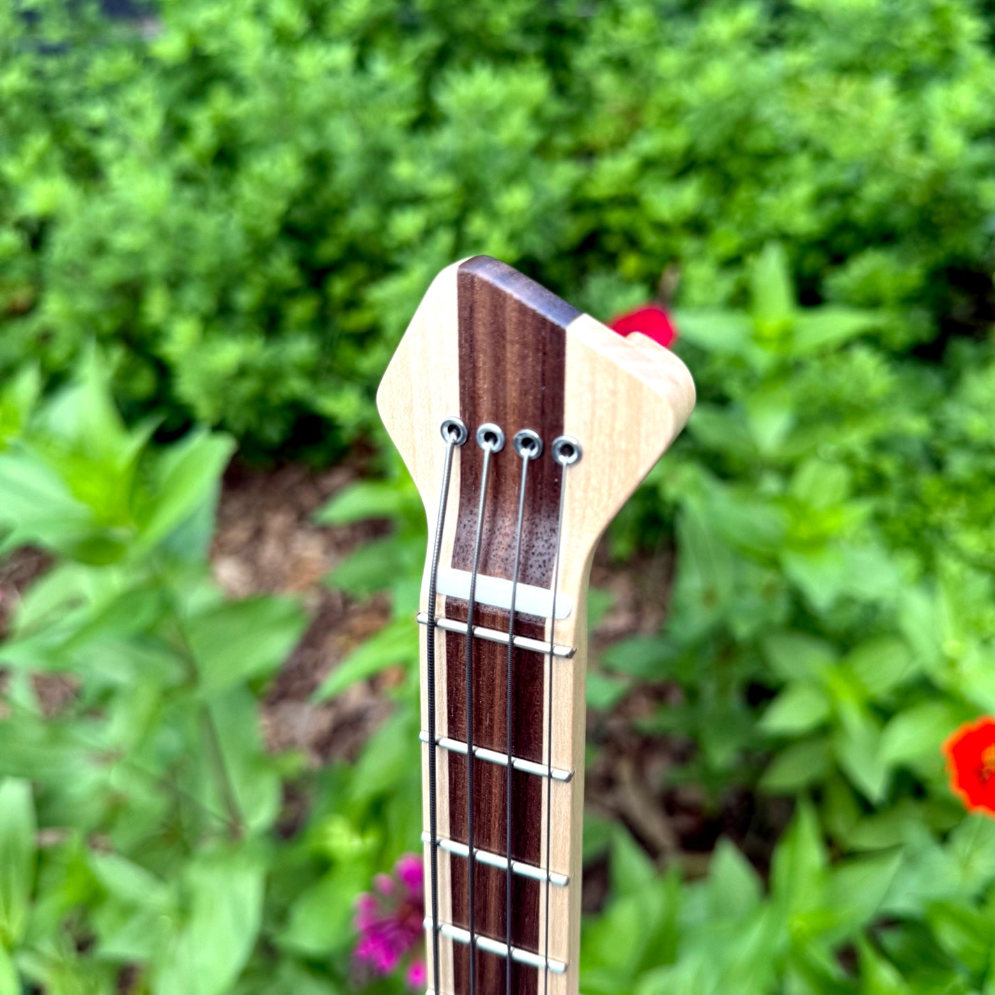 Close-up of the head of a custom ukulele.